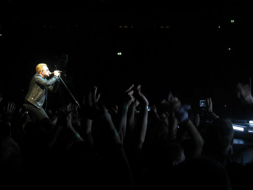 Bono performing during U2's concert in Berlin 2015